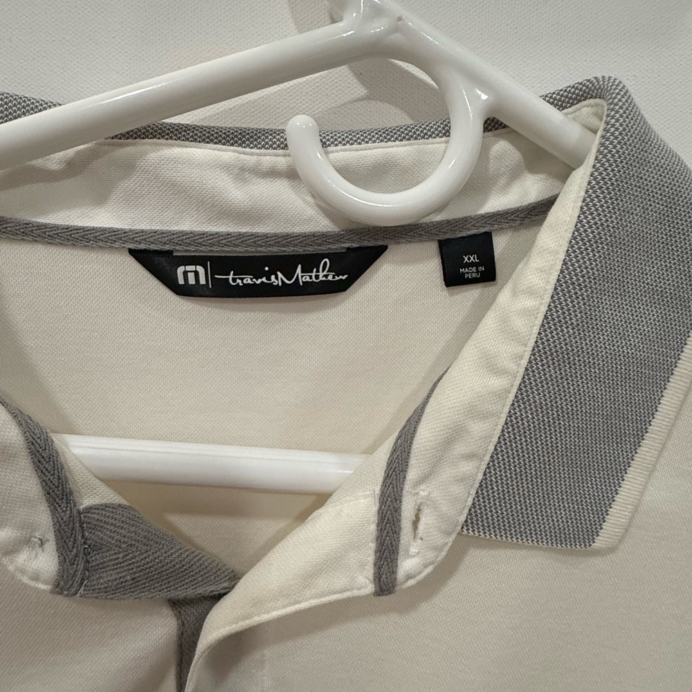 Travis Mathew polo. XXL. Good condition. Off white and grey.